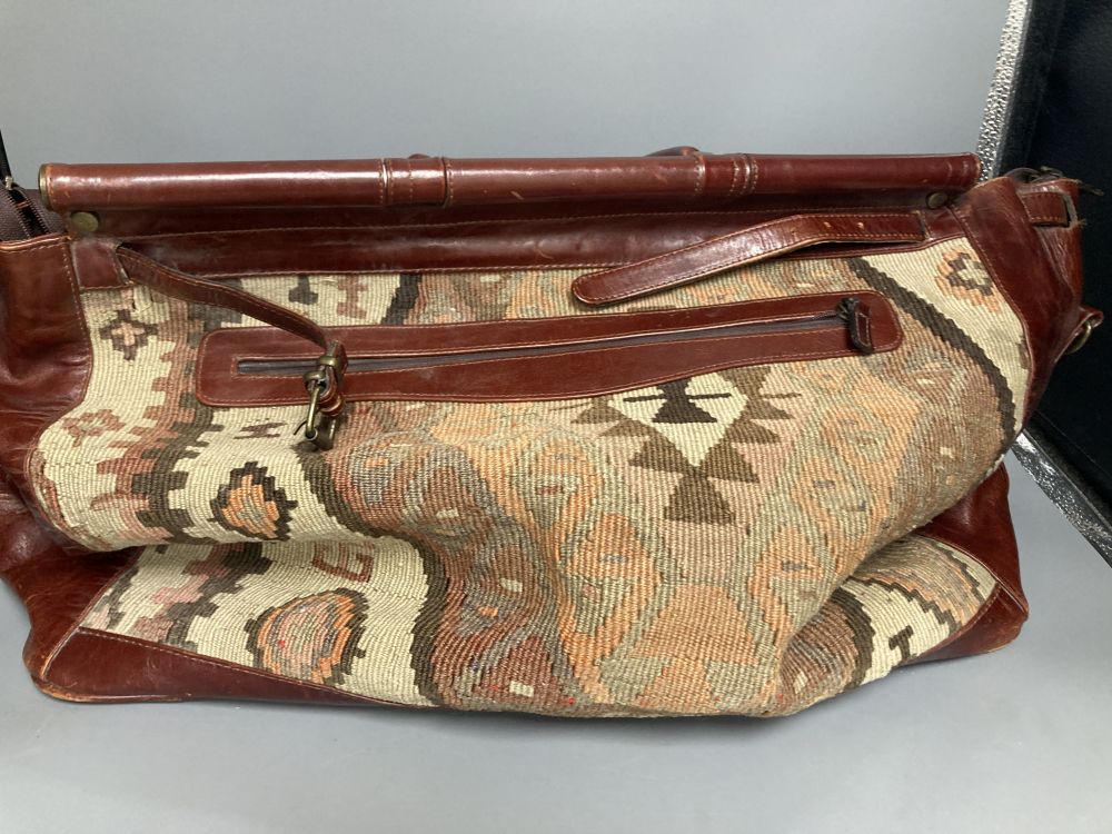 A Kelim Art, Turkey leather and needlework holdall, width 52cm